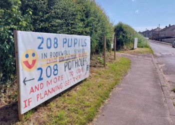 Banners protesting housing plans for West Cumbrian town