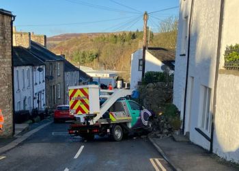 Cumbrian town centre blocked after cherry picker crashes into wall